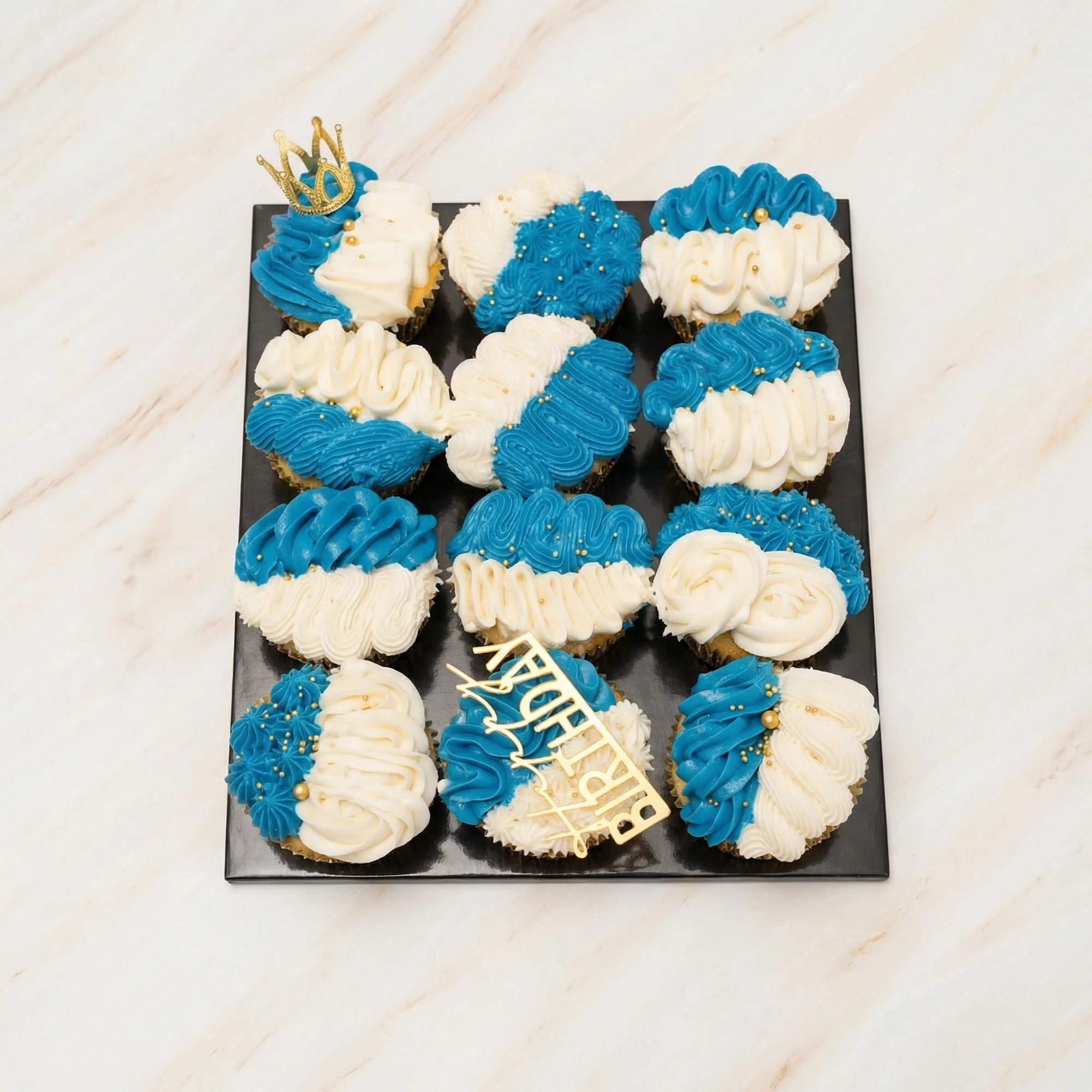 Birthday cupcake bouquet in Bahamas with blue white frosting and luxury presentation